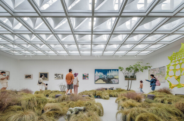 A grid of customized skylight modules creates a highly sculptural gallery ceiling